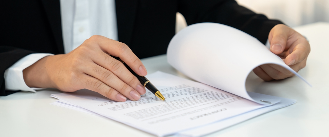 man looking over a contract