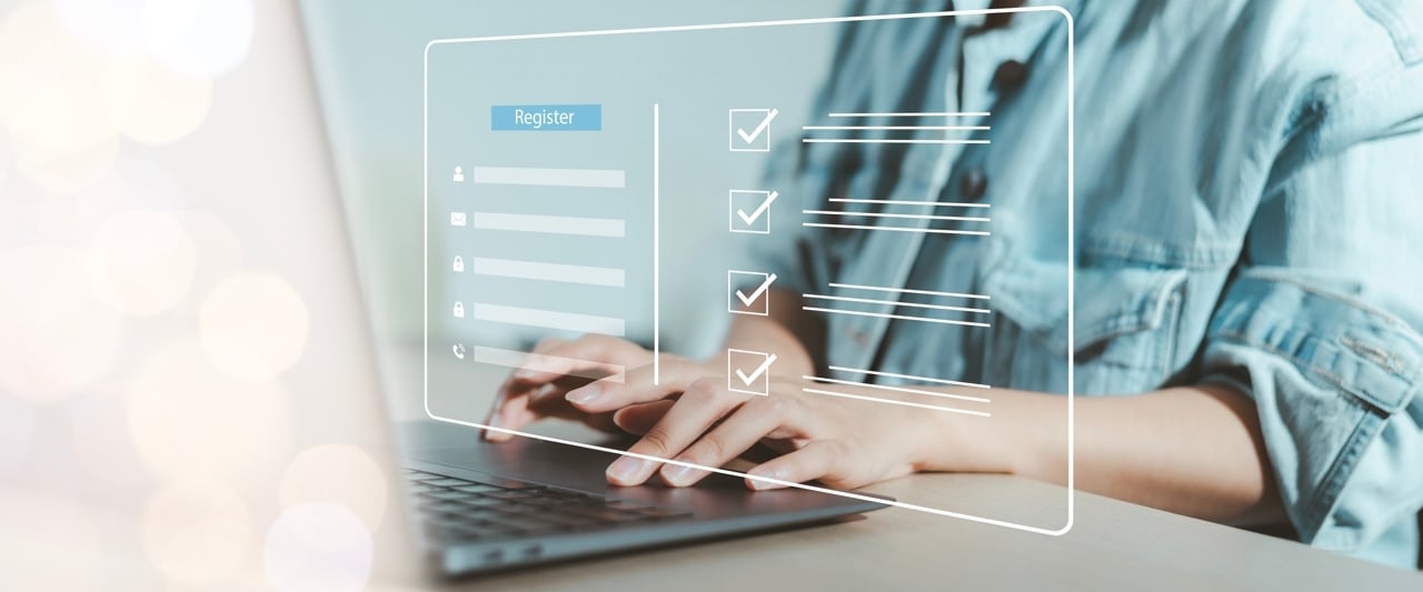 Woman registering on computer