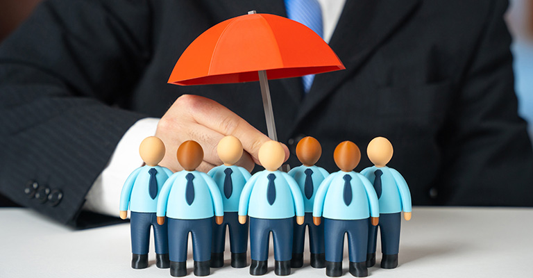 A decorative image with a group of wooden figures under an umbrella