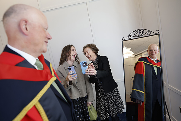 Chief Justice Donal O'Donnell receives an Honorary Doctorate from Dublin City University, admired by his daughter Aoife and his wife Mary Rose Binchy