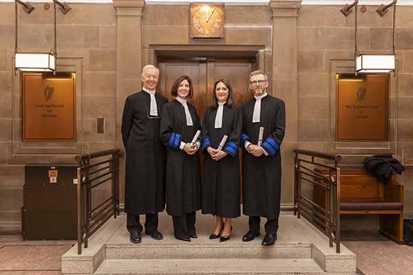 District Court President Judge Paul Kelly with solicitors Áine Clancy BL, Catherine Ghent, and Peter White who are now judges of District Court