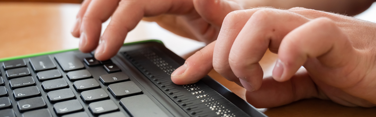 female hands using an assistive keyboard