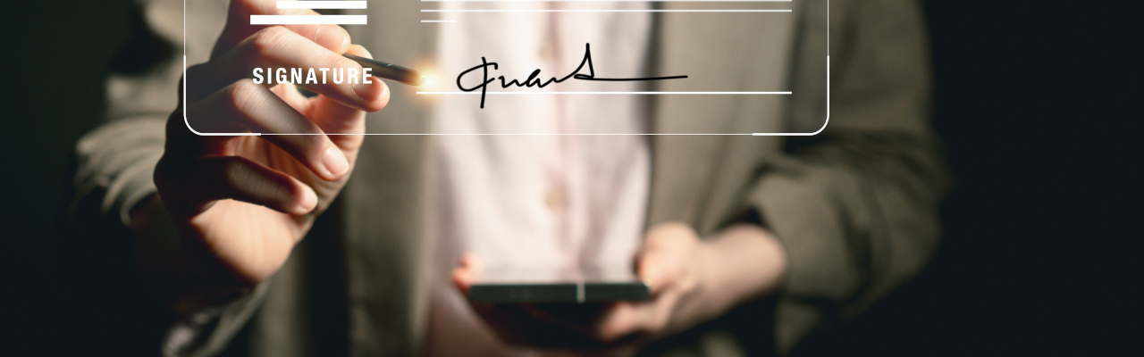 a female hand signing a digital document