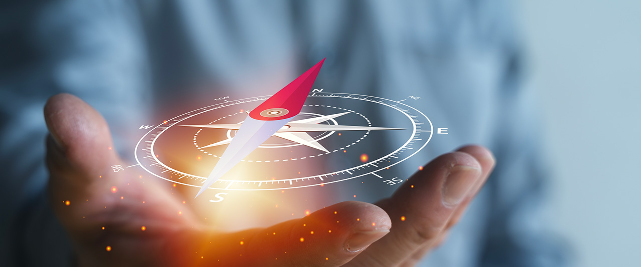 A hand holding a digital representation of a compass