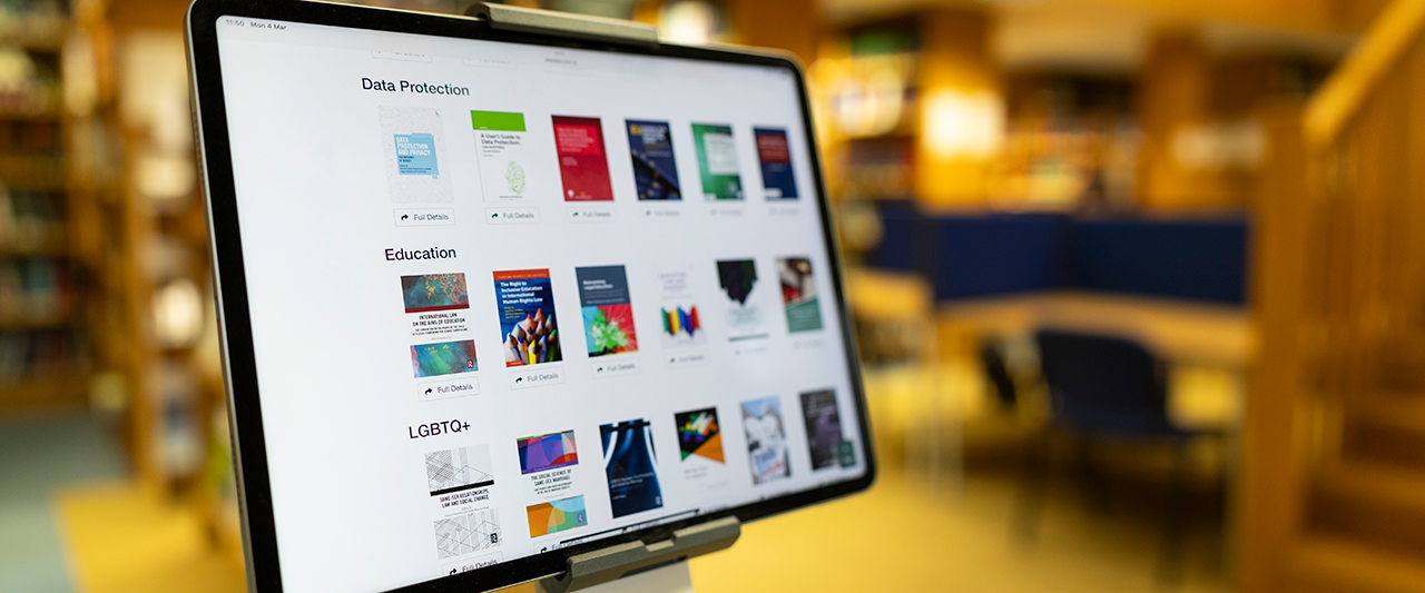 A tablet computer in the Law Society Library with different legal topics displayed