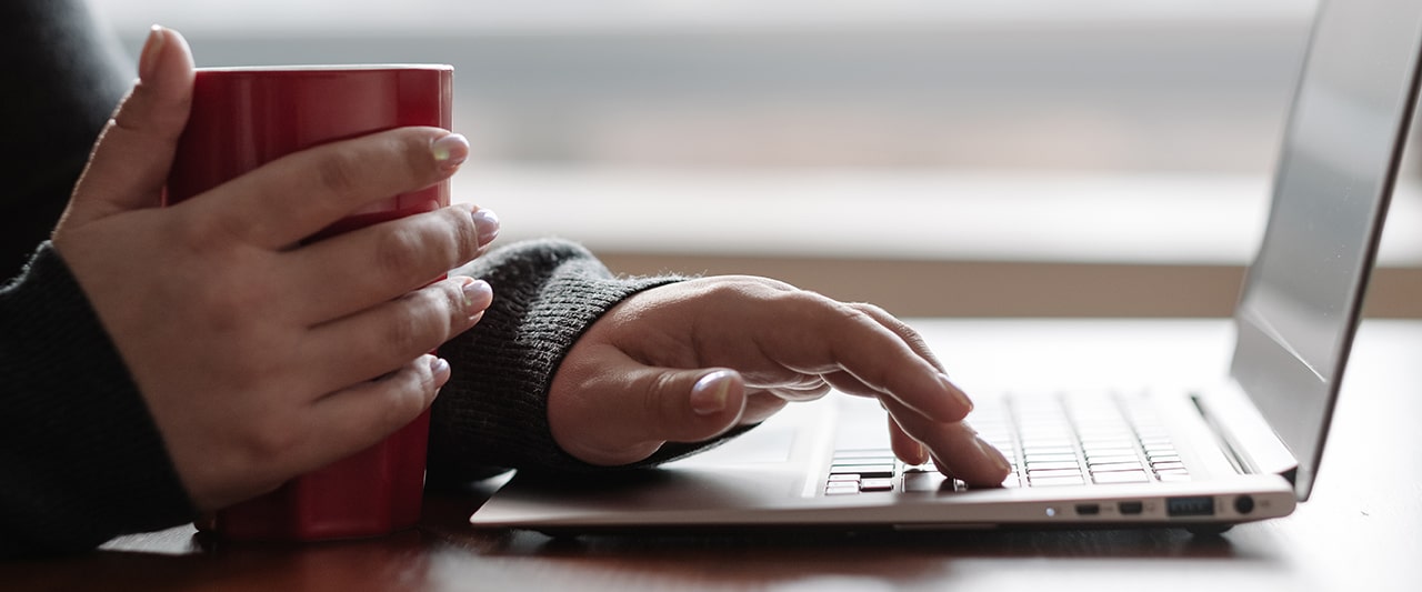 A person reading information on a tablet