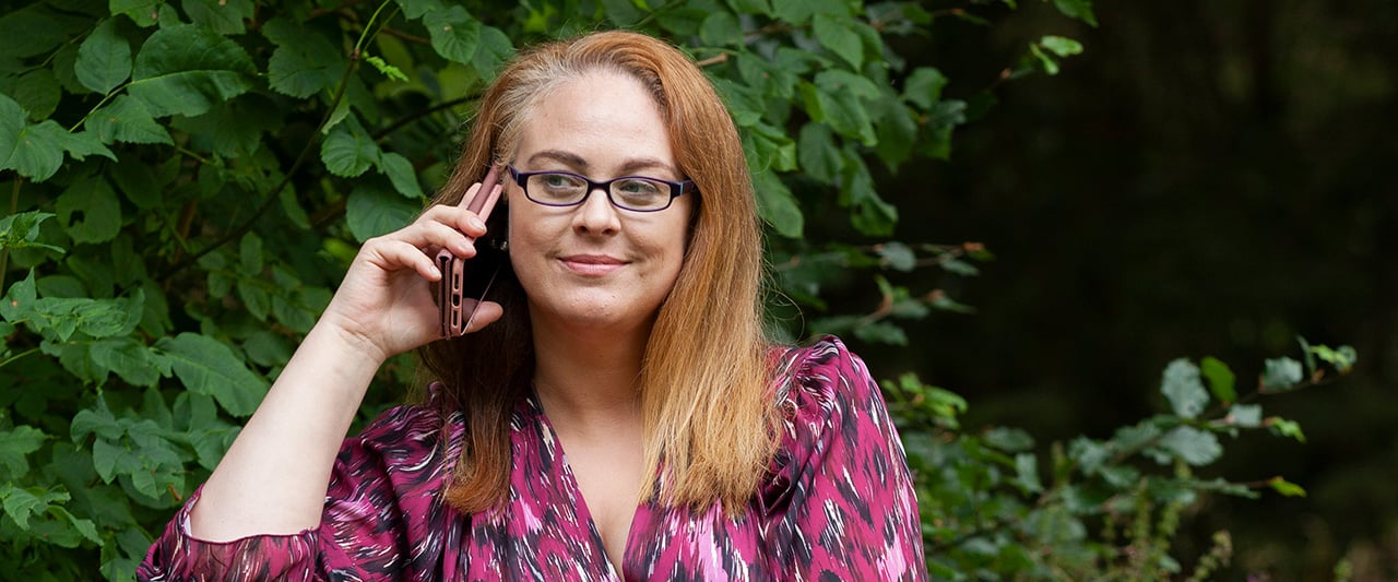 Solicitor on the phone in a garden setting