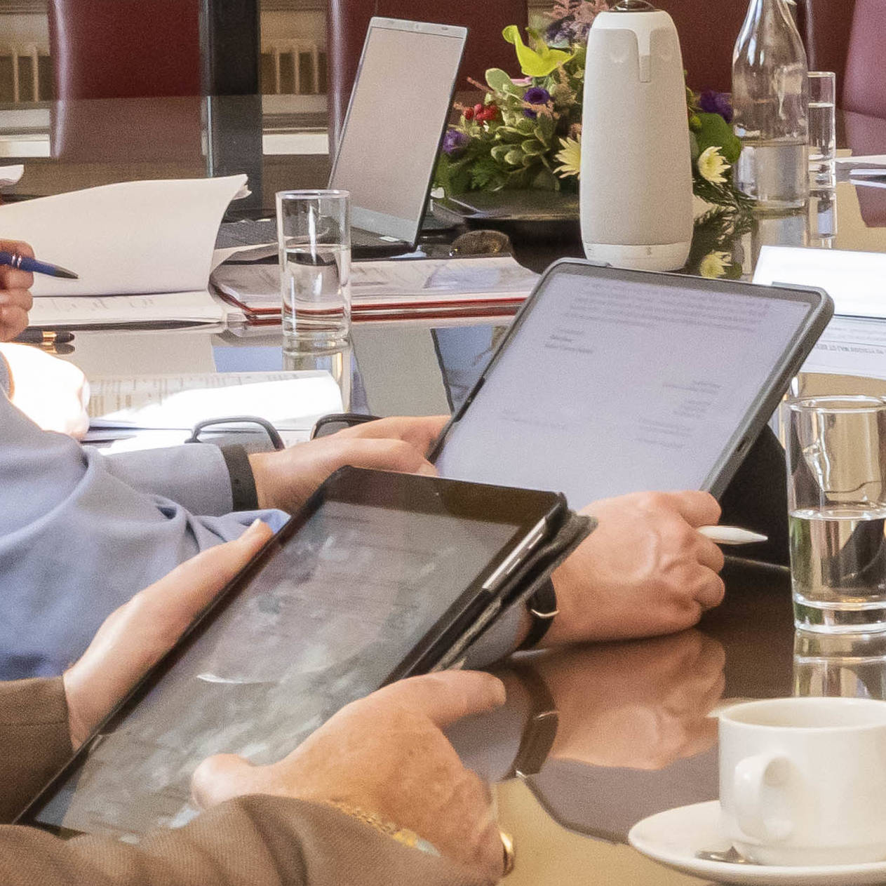 Tablets in use in a legal meeting.