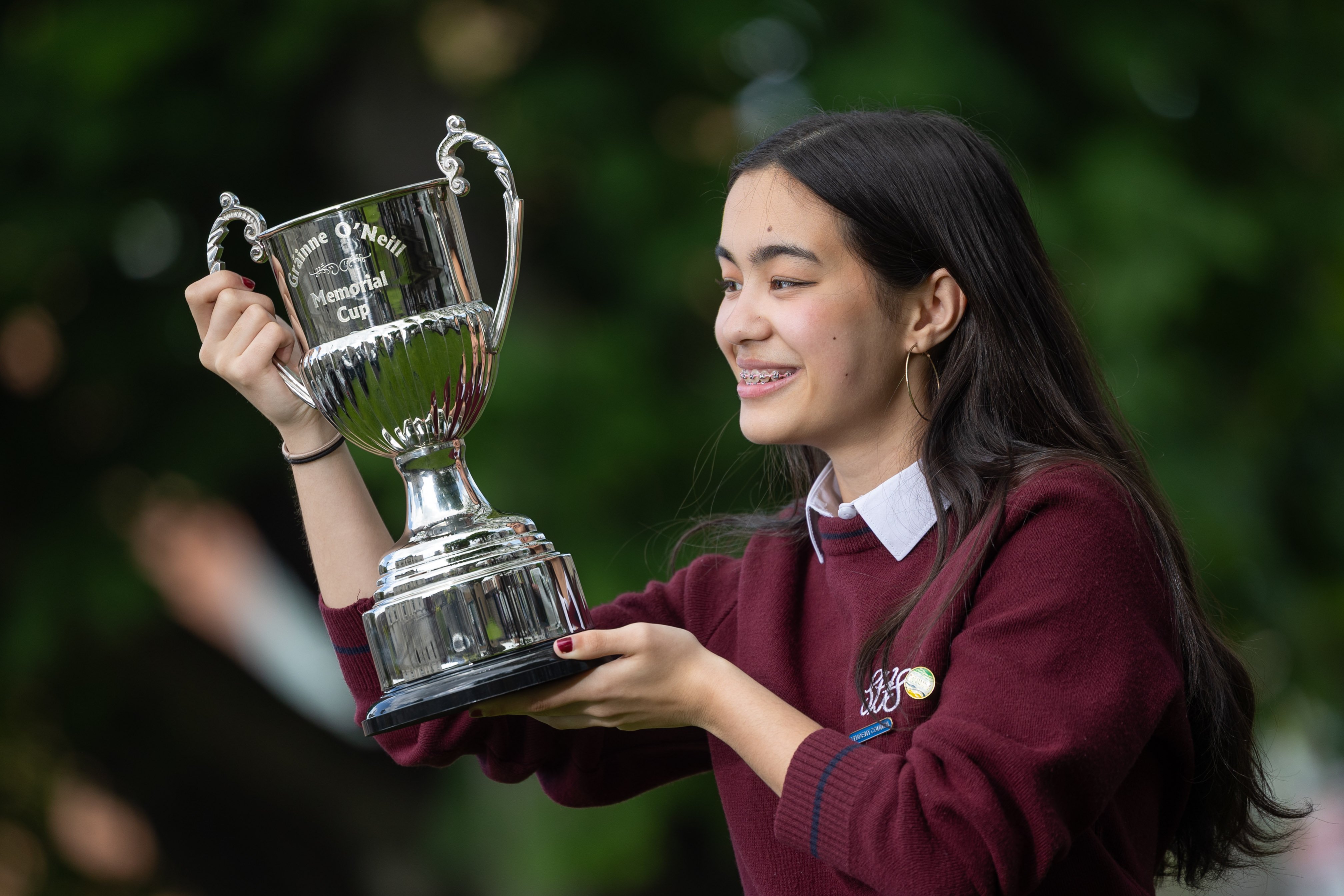 Rhea Schreiber from Sacred Heart Secondary School, Tullamore holds the grand prize trophy cup