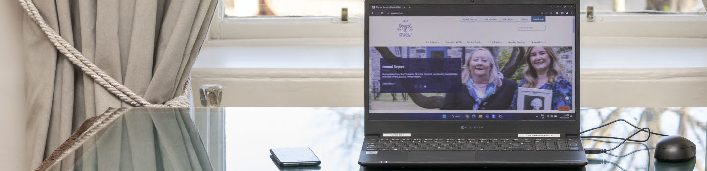 Computer and phone on a practitioner's desk